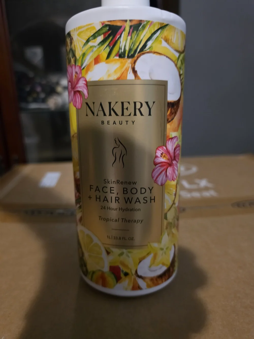 1-liter bottle of Nakery Beauty Tropical Therapy SkinRenew Face Body Wash W/pump